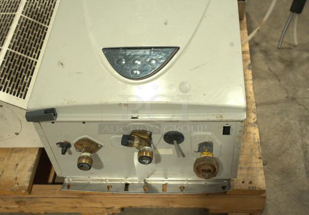 TAKAGI AT-H3-DV-N tankless water heater, 199,000 BTU, natural gas, indoor, ultra-low NOx, visible control panel, good condition.