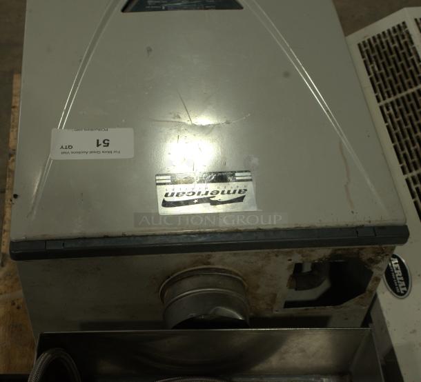 TAKAGI AT-H3-DV-N tankless water heater, 199,000 BTU, natural gas, indoor condensing, Ultra-Low NOx, visible use marks.