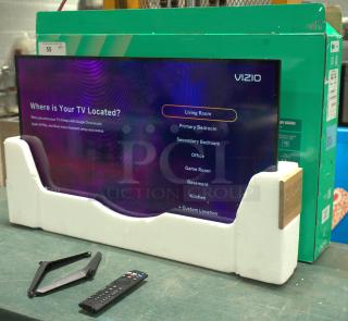 Brand new VIZIO 32" Class HD LED Smart TV, in packaging with remote and stand. Ideal for various room settings.