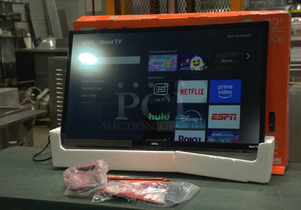 Brand new Onn 32" 720P HD Roku Smart TV, in packaging. Includes remote and accessories. Display shows streaming apps.