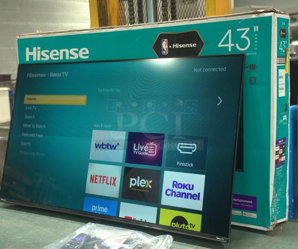 Brand new Hisense 43" Class 4K UHD LED LCD Smart Roku TV HDR R6 Series 43R6E3 with original packaging, displaying home screen.