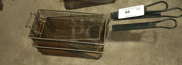 Heavy-duty twin fryer basket, 13-1/4" x 6-1/2" x 5-7/8", green plastic handle, front hook, used condition, item tag visible.