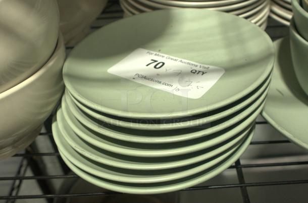 7.5" vintage Japanese melamine dishes, stack of 10. Light green, heavy-duty, good condition. Label: Lot 70, 7.5" size.