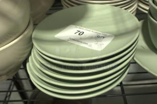 7.5" vintage Japanese melamine dishes, stack of 10. Light green, heavy-duty, good condition. Label: Lot 70, 7.5" size.