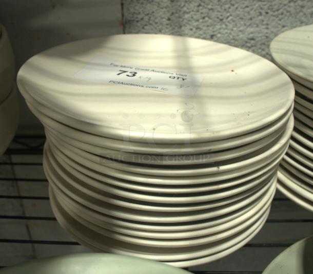 Stack of 8" vintage-style plates in cream color. Good condition. Label shows auction info and quantity of 8.