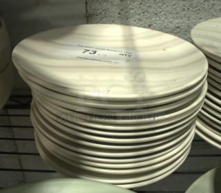 Stack of 8" vintage-style plates in cream color. Good condition. Label shows auction info and quantity of 8.