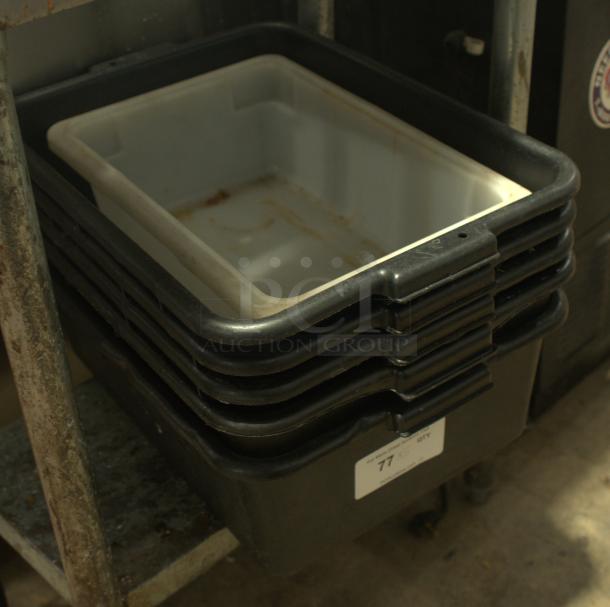 Heavy-duty commercial grade plastic bus box, ideal for bussing and storage. Shows signs of use, in fair condition. Label indicates quantity as 77.