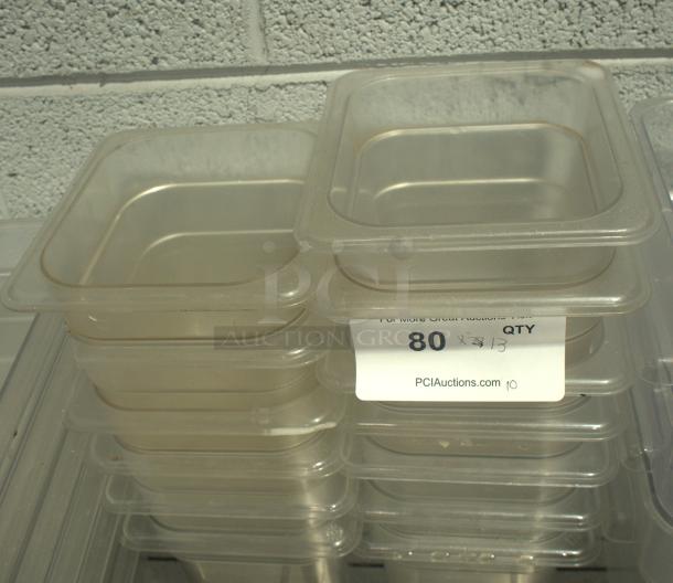 Heavy duty clear plastic 1/6 size cold food storage containers stacked, in used condition, with quantity label of 80.