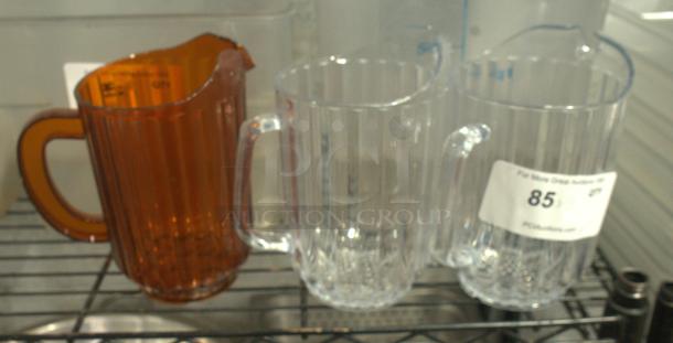 Heavy-duty break-resistant 60 oz plastic restaurant pitcher. Clear and amber colors, sturdy handle, ribbed design.
