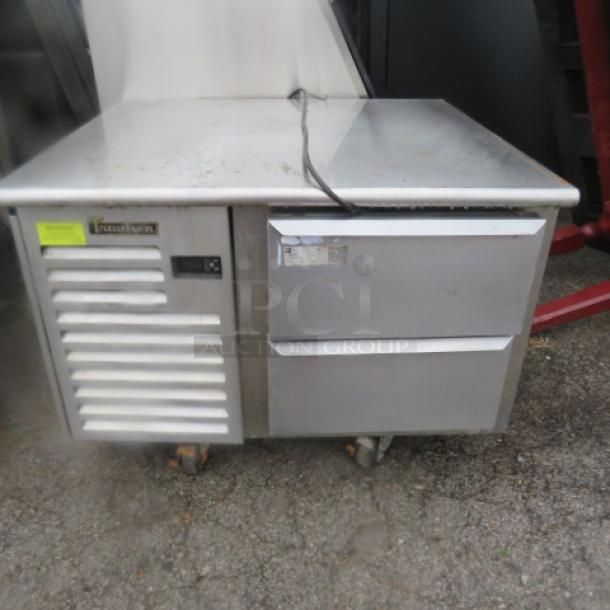 Traulsen 2-drawer refrigerated prep table on casters, stainless steel, working condition, with brand and model labels visible.