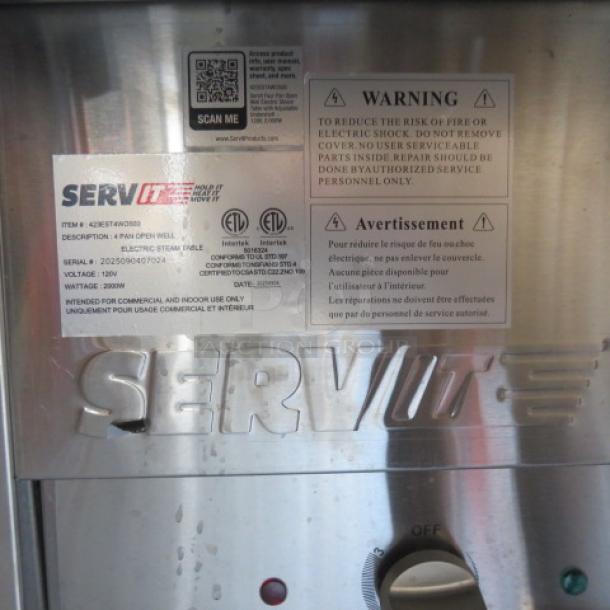 Servit 4 Well Electric Steam Table, Model# 423EST4WO500, with sneeze guards, cutting board, SS undershelf, and casters.