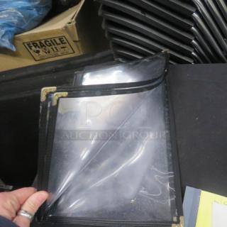 One lot of 20 clear 4-page menu holders with black trim and gold corner accents, used condition.