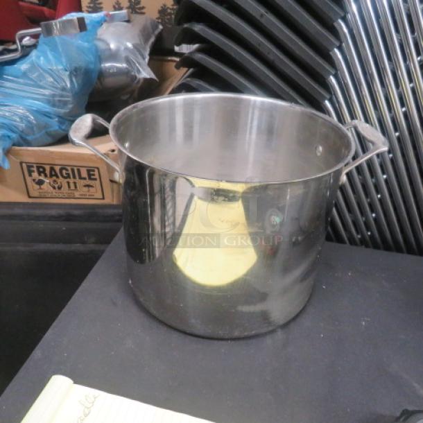 Cuisinart 12 Quart stainless steel stock pot, shiny finish, sturdy handles, in good condition, ideal for large batch cooking.