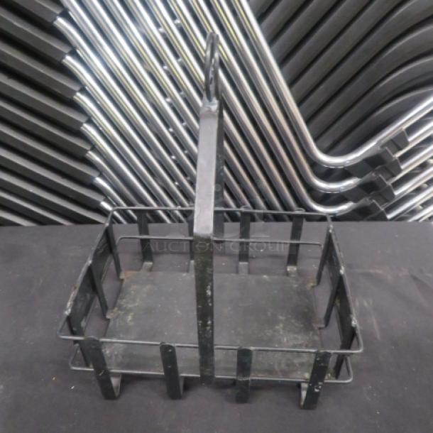 Black metal table top condiment/menu holder, model 5XBID, with grid design and handle. Good condition.