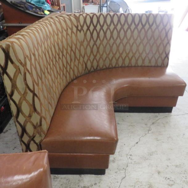 Brown cushioned corner booth, 59x27x42 inches, with diamond pattern backrest. Good condition. Ideal for restaurant seating.