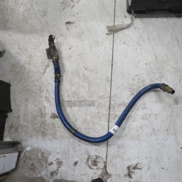 A blue gas line with metal connectors, approximately 3 feet long, shown on a concrete floor. Features a label with the number 60.