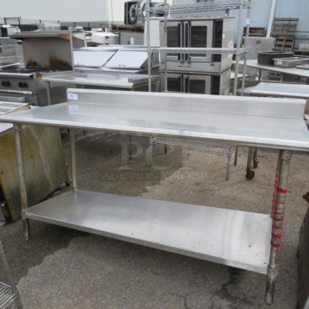 Stainless steel table with backsplash and undershelf, 72x30x38 inches. Good condition, ideal for commercial kitchens.