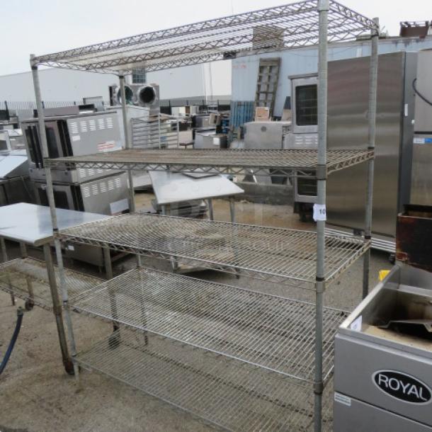 Metal Metro shelf unit with five adjustable wire shelves. Measures 60x24x75 inches. Used, with visible wear.