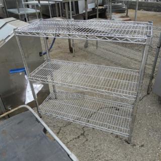 Chrome Metro shelf unit with 3 adjustable shelves, dimensions 36x14x35 inches. Good condition with minor wear. Ideal for storage.