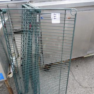 Green coated Metro shelf, 36x21 inches, sturdy metal. Includes tags, item number 117. Excellent condition for storage use.