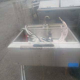 Stainless steel under bar ice well with 2 Wunderbar guns and dual hand sink with faucet, moderate wear.