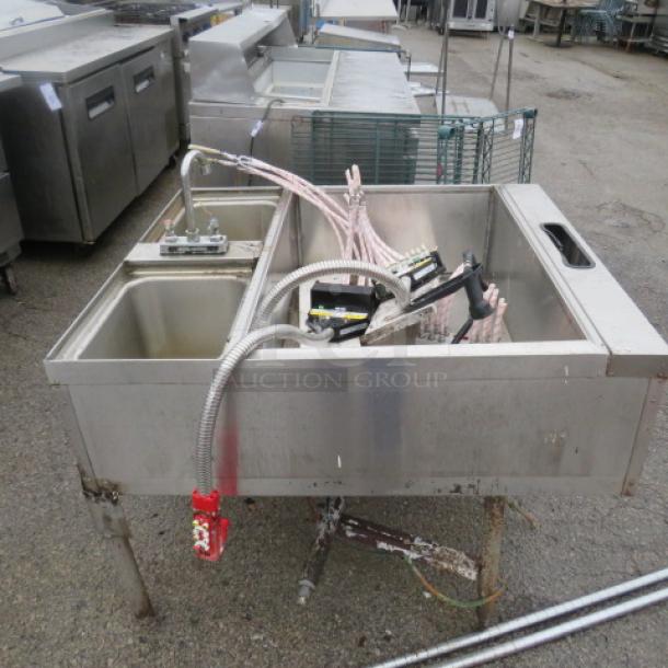 Stainless steel under bar ice well with dual hand sink and faucet, includes two Wunderbar guns, suitable for commercial use.