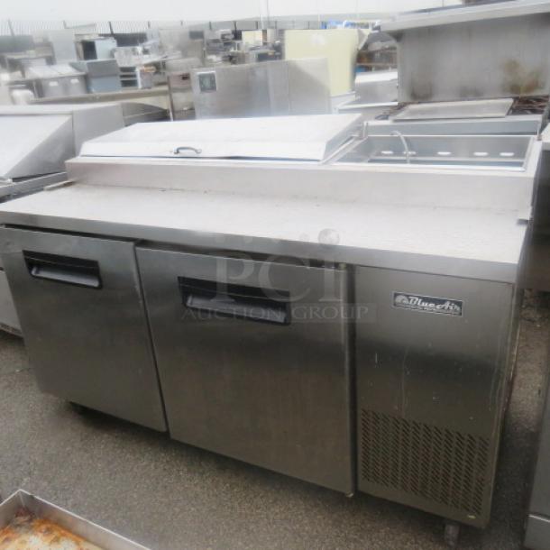 Blue Air 2-door refrigerated prep table, Model BAPP67, with 2 racks on casters. Missing 1 lid. Dimensions: 67x32x43 inches.