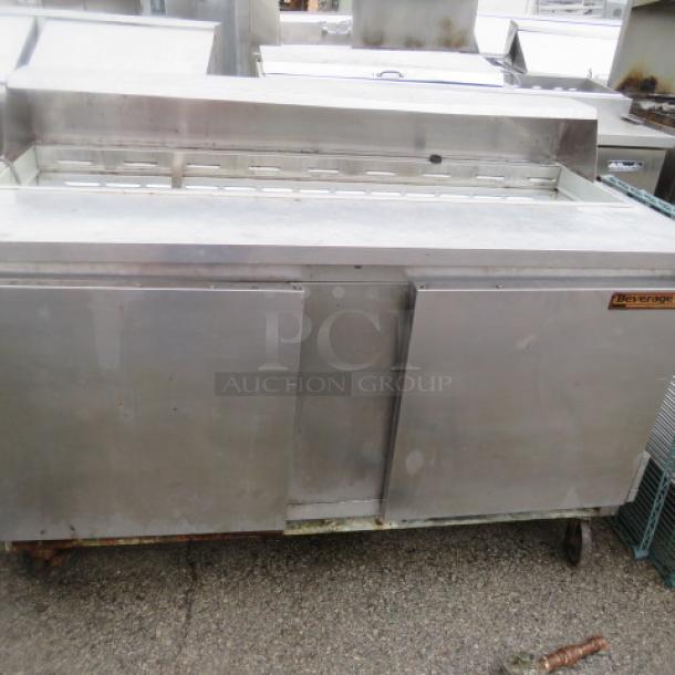 Beverage Air SP60-16 refrigerated prep table, two doors, one rack, on casters, no lid, stainless steel, 60x29x43 inches.