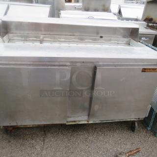 Beverage Air SP60-16 refrigerated prep table, two doors, one rack, on casters, no lid, stainless steel, 60x29x43 inches.