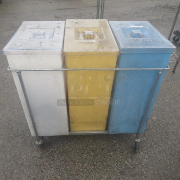 Three ingredient bins with lids, colored white, yellow, and blue, placed in a wire rack on casters, dimensions 29x15x29 inches.