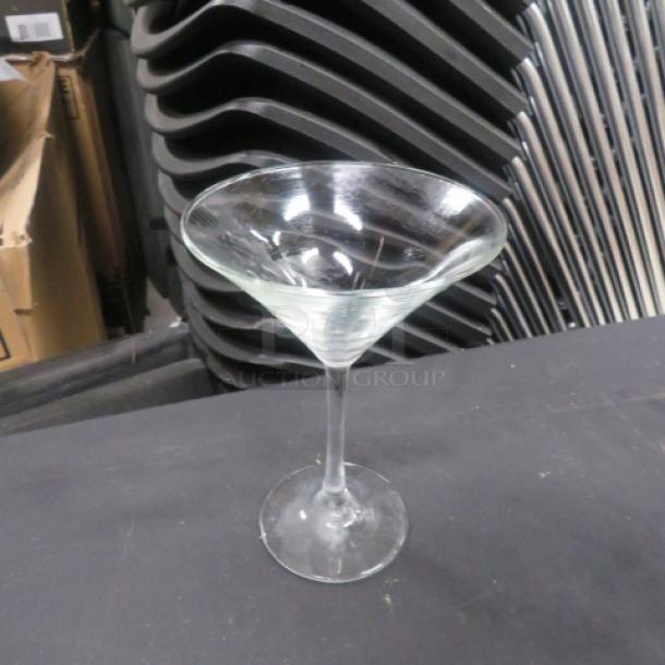 Clear glass margarita glass with a wide, round bowl and slender stem. Appears in good condition. No visible markings.