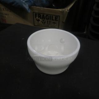 White ceramic salsa bowl, excellent condition, model 12XBID, smooth finish. Fragile label box visible in background.