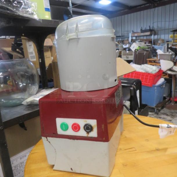 Robot Coupe R2BCLR food processor, 120 Volt, used condition with visible wear. Red and beige housing, power buttons visible.