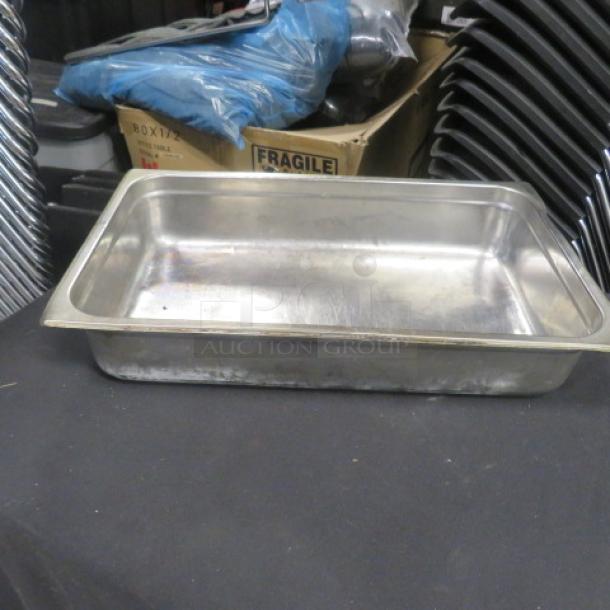 Full size 4-inch deep hotel pan, stainless steel, used condition. Ideal for professional kitchen use.