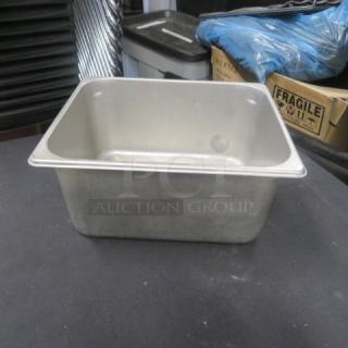 Stainless steel 1/2 size, 6-inch deep hotel pan in good condition. Ideal for catering or restaurant use.