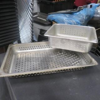 Assorted size perforated hotel pans, stainless steel, used condition, visible wear. Includes two pans, stackable design.