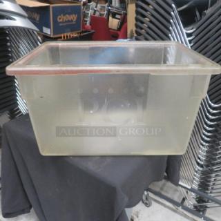 Clear 21.5-gallon food storage container, rectangular, sturdy plastic, no lid, used. Perfect for bulk storage needs.