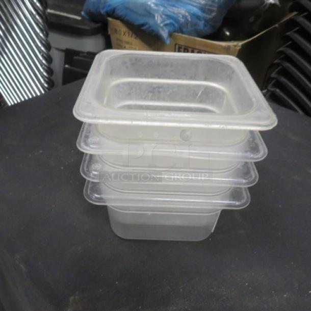 1/6 size 4-inch deep clear food storage containers, stackable, used condition, ideal for commercial kitchen use.