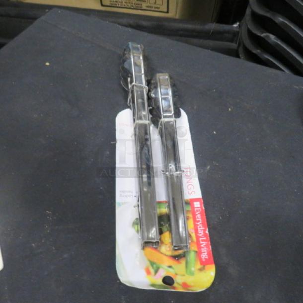 NEW Stainless Steel Tong, 2XBID, Everyday Living brand, in packaging, polished finish, sturdy grip, unused condition.