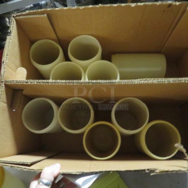 One lot of 10 store and pours without lids, beige, in cardboard box. Appears in used condition.