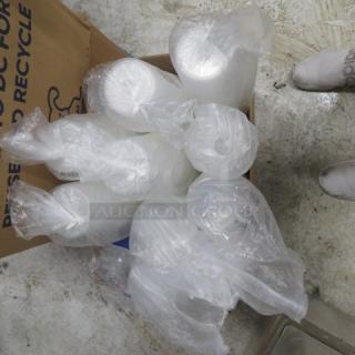 Assorted deli containers in plastic bags, placed in a cardboard box; varying sizes, new condition, ideal for food storage.