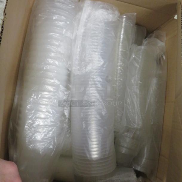 Box of assorted size deli containers, neatly stacked and wrapped in plastic. Items appear new and unused.