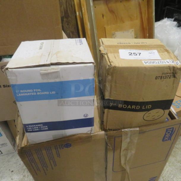 7-inch round foil lids in original packaging; boxes show "Laminated Board Lid," indicating contents for sealing use.