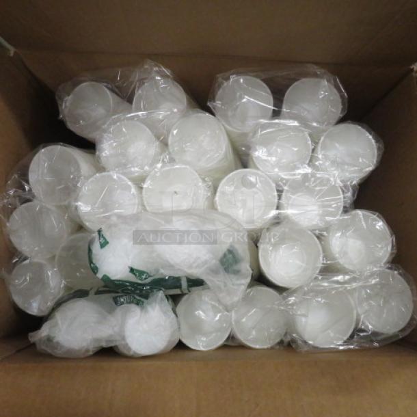 Box of plastic portion cups, wrapped in plastic, new condition. Suitable for food service or catering.