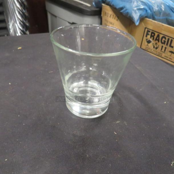 Clear rocks glass with slightly tapered design, in excellent condition. Model: 8XBID. No visible chips or scratches.