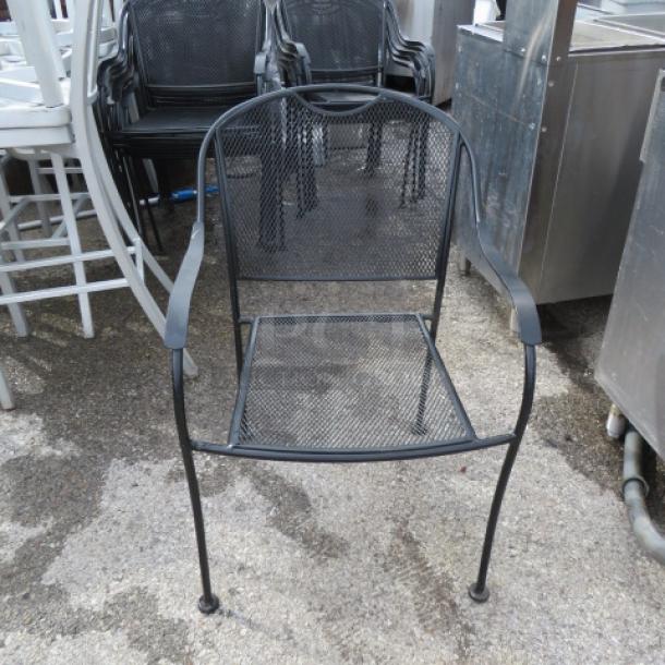 Black metal patio chair with mesh seat and backrest. Sturdy construction, slightly weathered finish. Model: 2XBID.