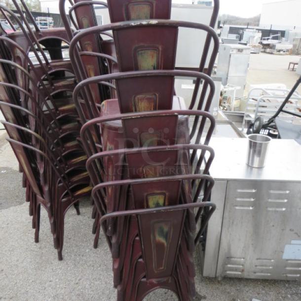 Stack of distressed industrial metal chairs, suitable for indoor/outdoor use, showing weathered finish.