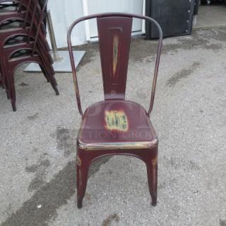 Industrial distressed metal chair, indoor/outdoor use, rust-red finish, weathered look, stackable.