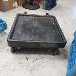 One Carlisle dish rack dolly, square black design, worn condition, features swivel casters, ideal for easy transport.