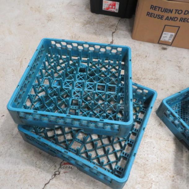 Blue dish rack made from durable plastic, stackable design, good condition, model 2XBID. Suitable for kitchen storage.